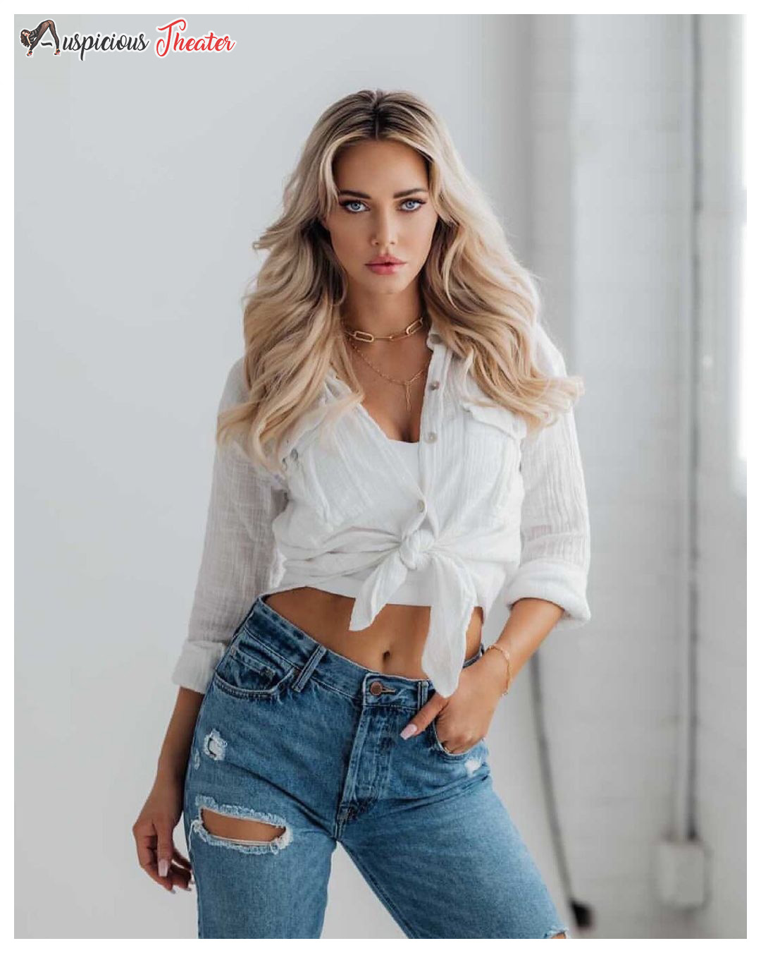 kourtney kellar in white shirt and tear jeans 